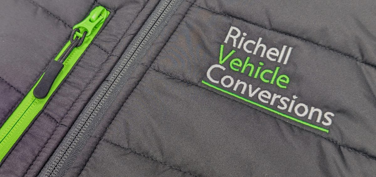 Richell Vehicle Conversions branded black gilet, customised with their green logo and zip.