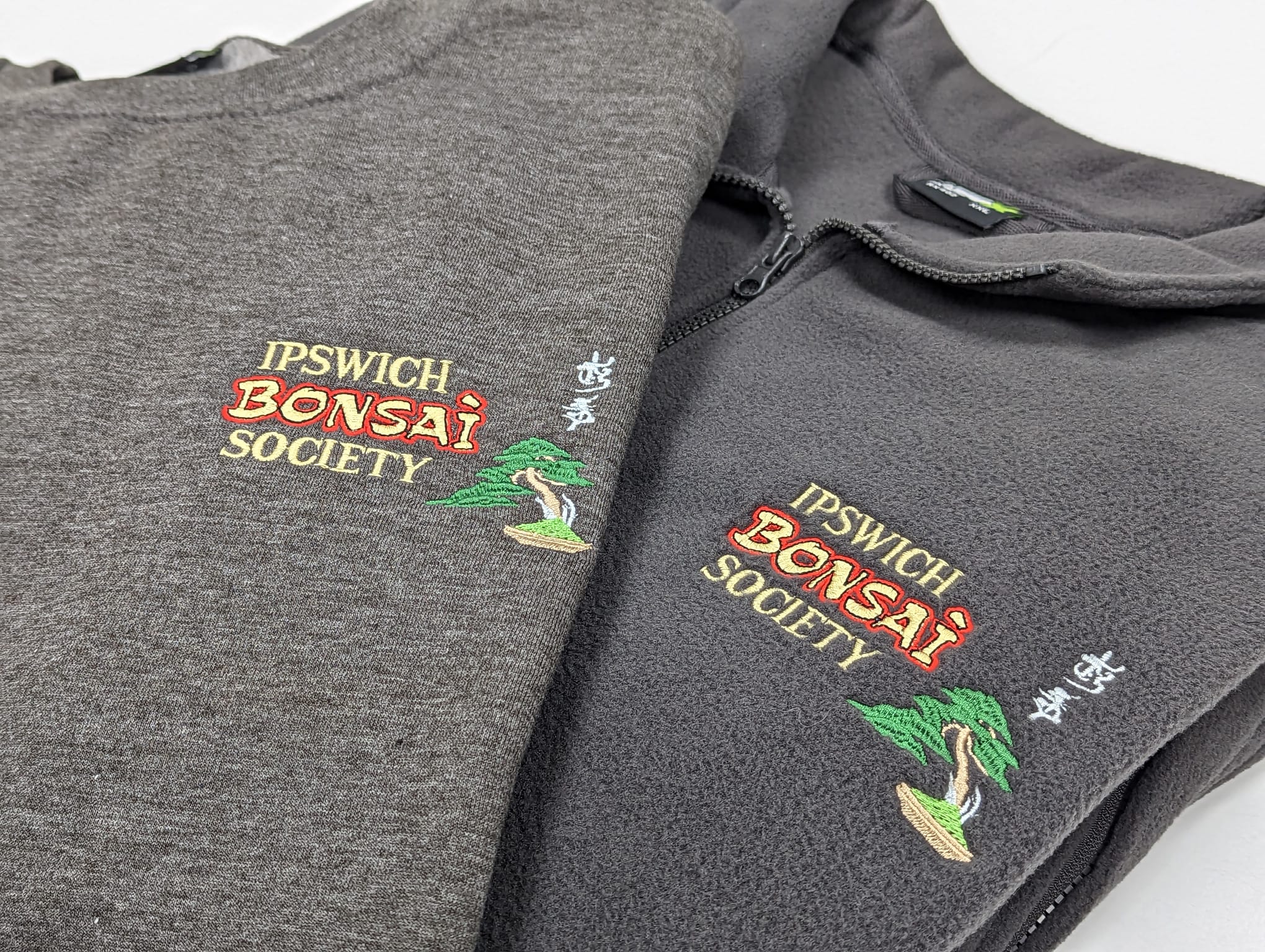 Branded Tshirts and Fleeces for Ipswich Bonsai Society Ipswich Bonsai Society branded dark grey sweatshirt and fleece, customised with their bonsai logo