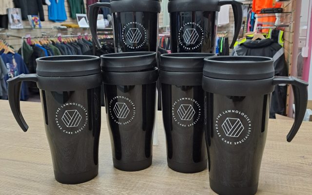 The Lawnologist branded black travel mugs, customised with their logo.