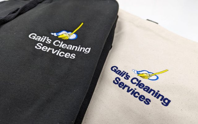 Gail's Cleaning Services branded workwear in black and cream, customised with their cleaning tools logo.
