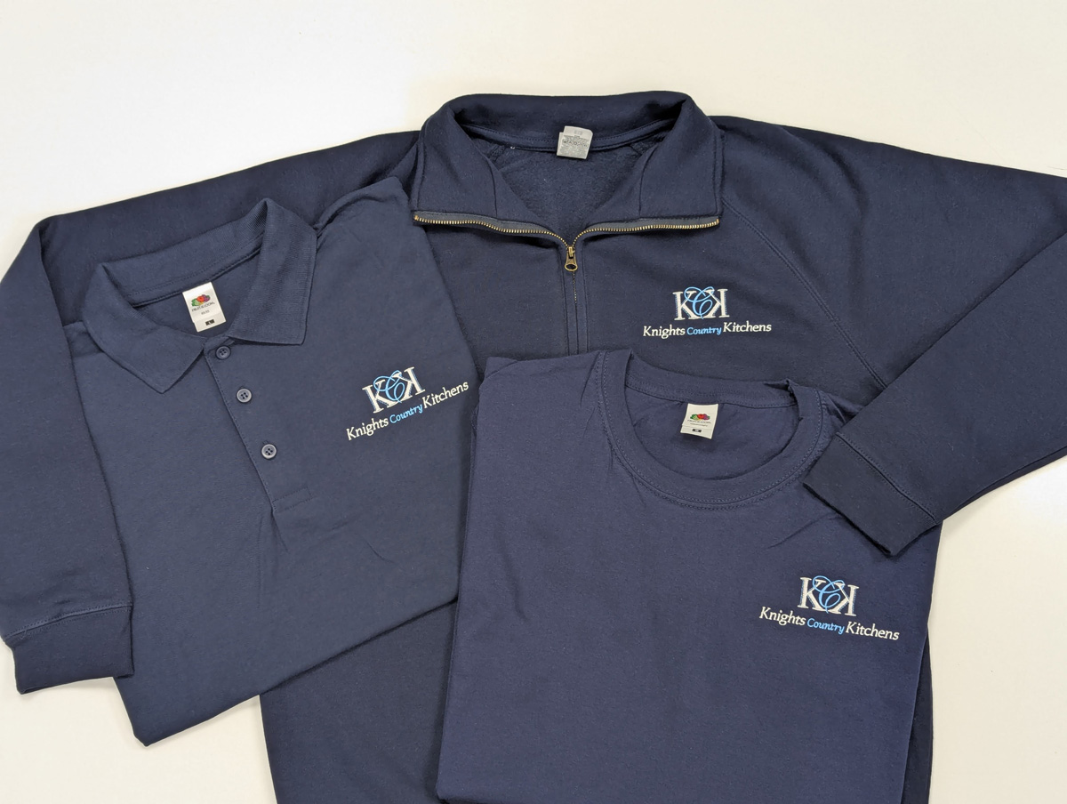 Knights Country Kitchens branded navy tops: quarter-zip, polo, and t-shirt, customised with their logo.