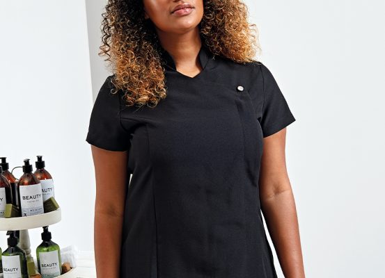 Black spa tunic, a professional uniform for the salon industry.