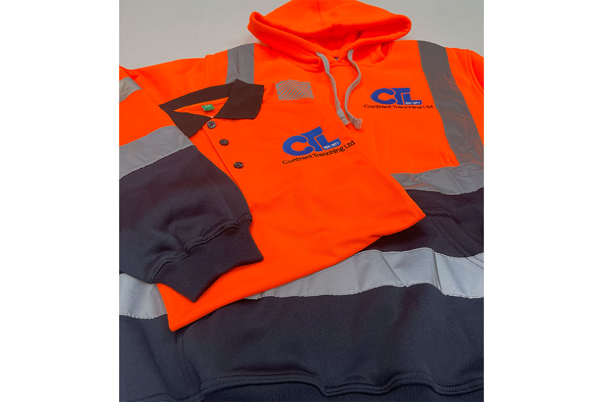 Contract Trenching Personalised hi-vis workwear for Contract Trenching: orange safety hoodie and polo shirt with company branding